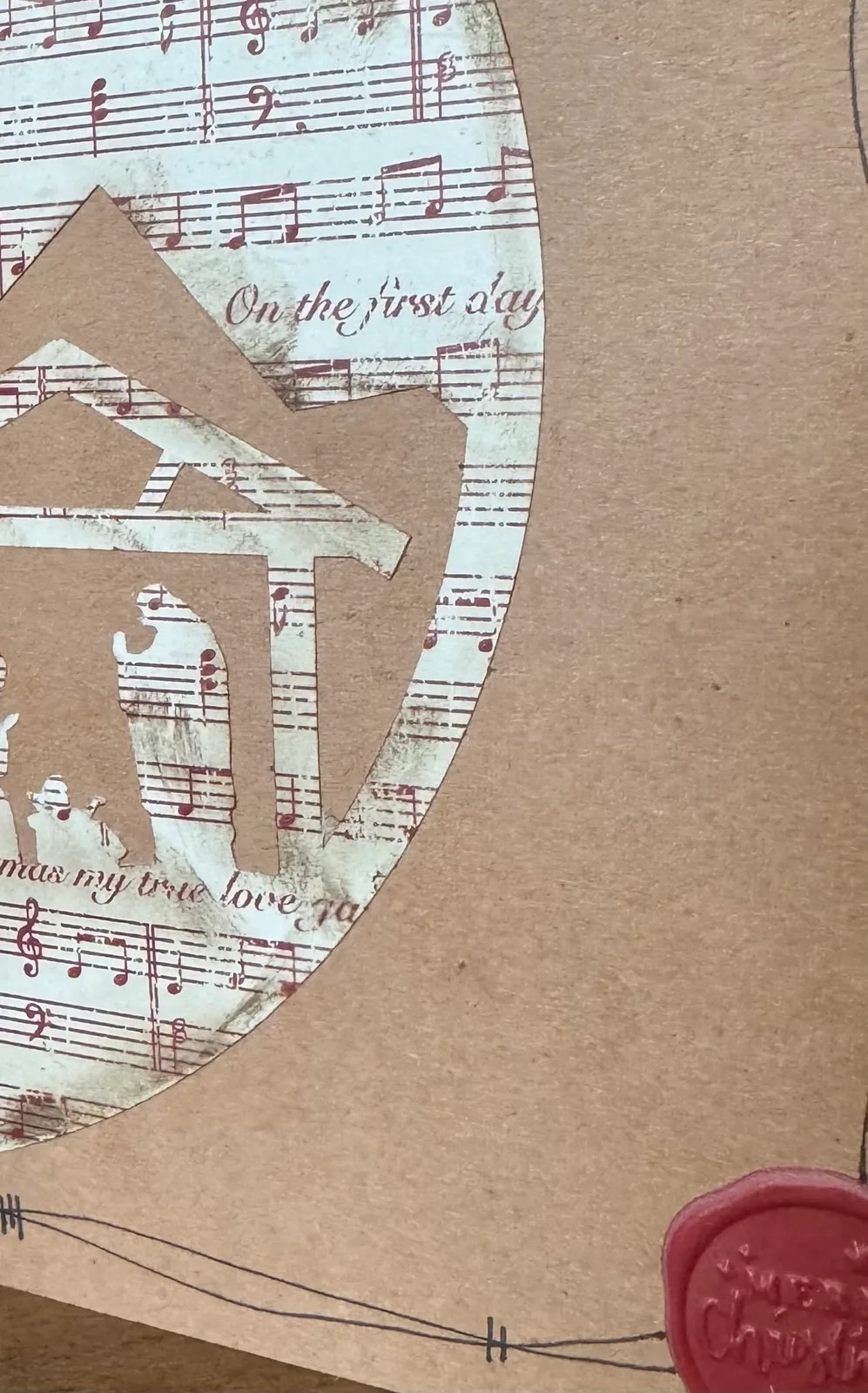 Close-up of a handmade winter design with music notes.